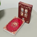 Fairy Tale Dream Lenormand deck beside crimson rigid box featuring four illustrated fairy tale character panels on the front
