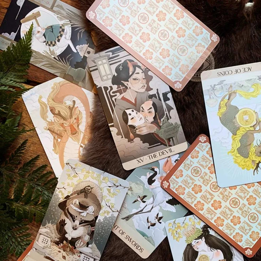 Yōkai Tarot deck open in rigid box showing The Fool card with Japanese folklore creature illustration