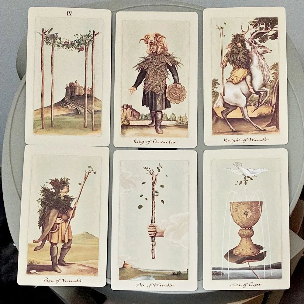Pagan Otherworlds Tarot — six face-up cards including The Moon, The Devil, Three of Pentacles, Ace of Pentacles, The Tower, Knight of Pentacles