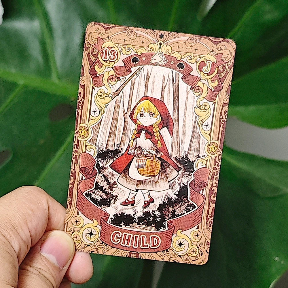 Fairy Tale Dream Lenormand card 13 — Child: Little Red Riding Hood in forest holding a basket, cartoon illustration with gold ornate border