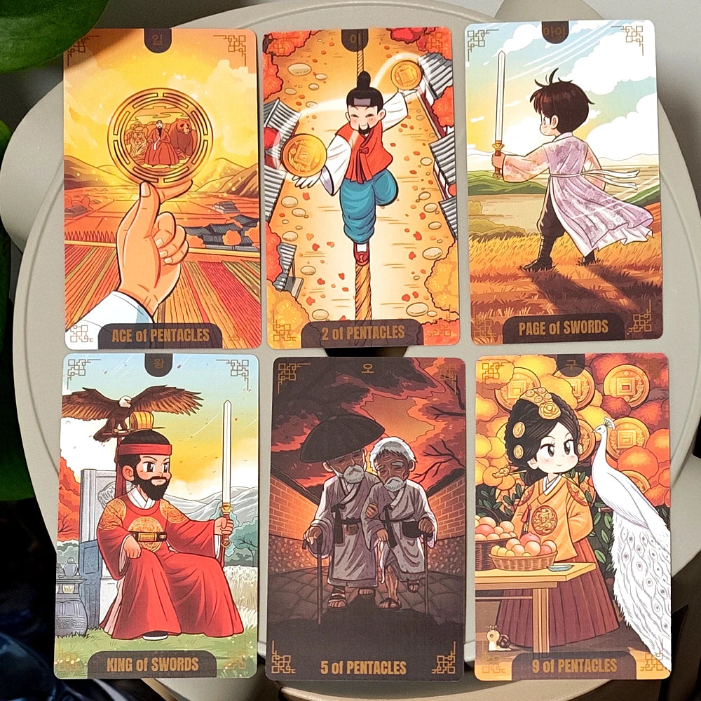 Korenji Tarot face-up cards: Ace of Pentacles, 2 of Pentacles, Page of Swords, King of Swords, 5 of Pentacles, 9 of Pentacles