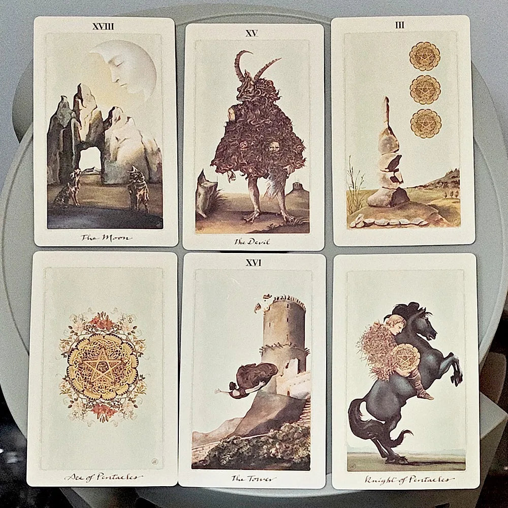 Pagan Otherworlds Tarot rigid box open with deck and brass coin, styled with candles and antique books
