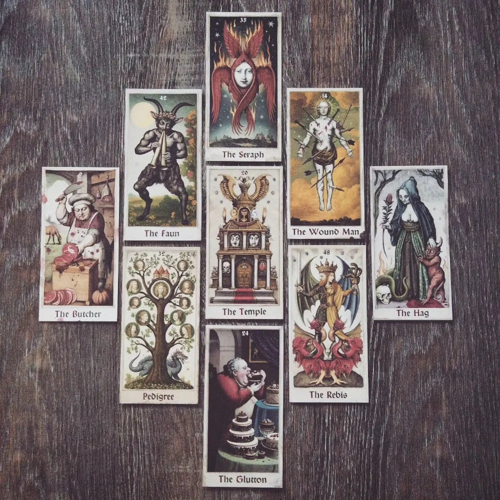 The Zammer Twin’s Oracle — nine cards displayed on wooden surface: The Butcher, The Faun (42), The Seraph (35), Pedigree (32), The Temple (20), The Glutton (24), The Wound Man (14), The Rebis (48), The Hag