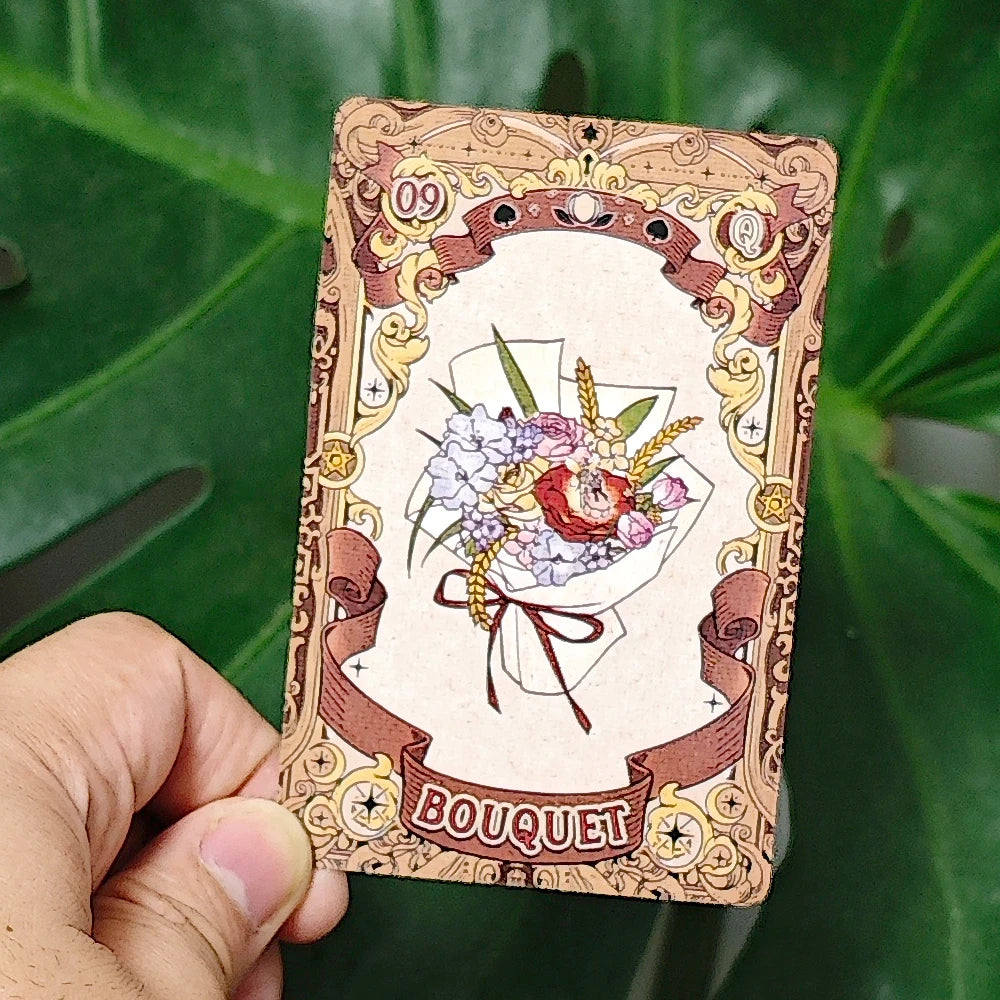 Fairy Tale Dream Lenormand card 09 — Bouquet: floral bouquet with roses, hydrangeas and wheat tied with a ribbon, ornate gold border